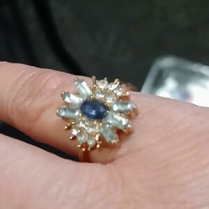 Gold Floral Halo Ring with Blue Center Stone